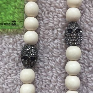 Ivory wood bead necklace with Silver pave skulls!